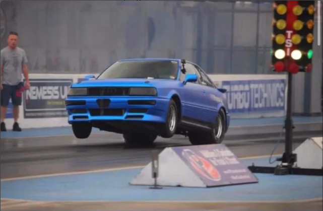 Audi 80 doing a wheelie at Santa Pod Raceway